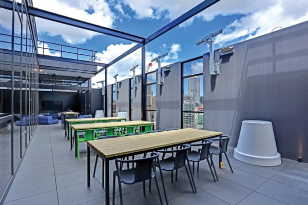 Students socializing on rooftop terrace