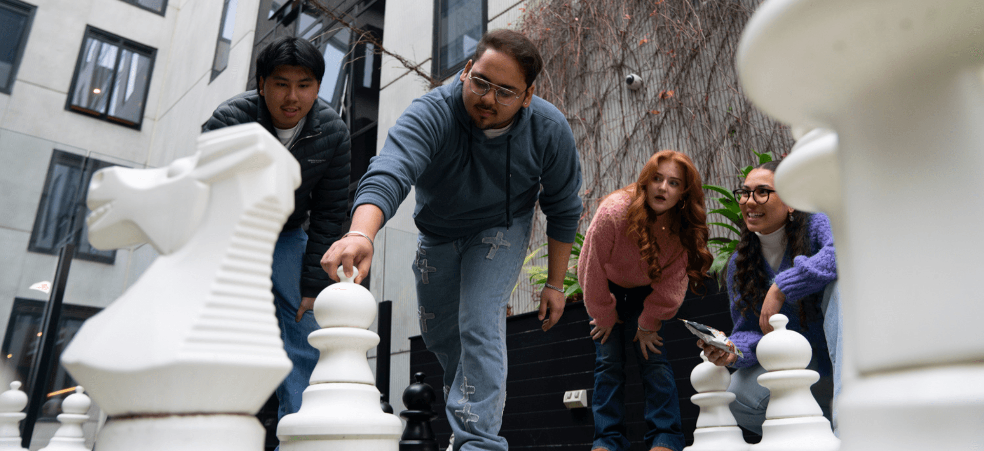 Students socializing on rooftop terrace